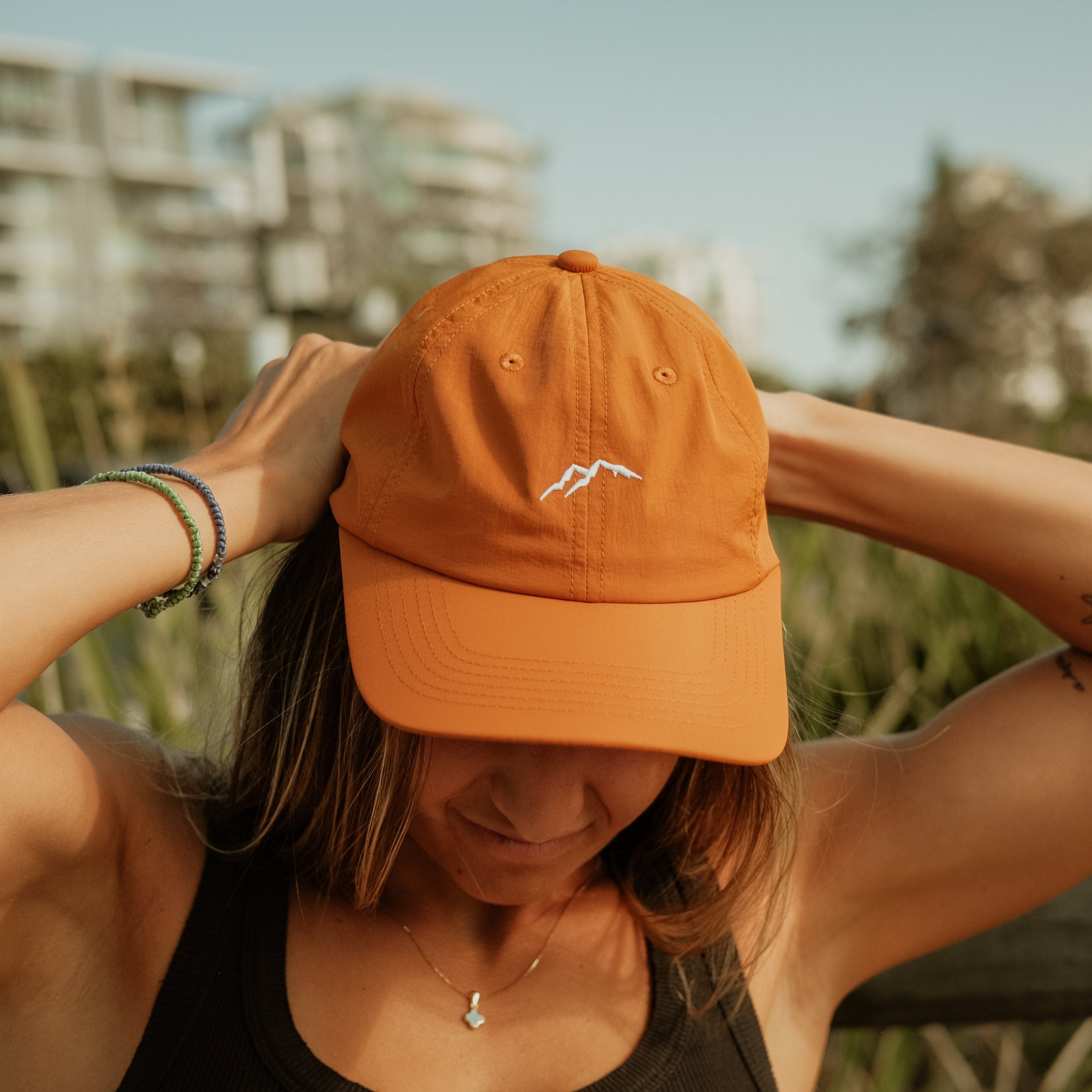 Brown outdoor cap by Get Rug'd, perfect for sunny adventures and outdoor activities