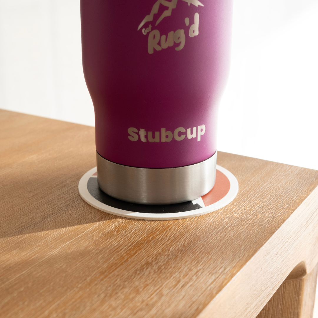 Get Rug'd car decal sticker coaster pack featuring a stylish drink coaster on a wooden table