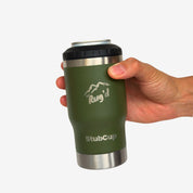 Hand holding StubCup Green Stubby Cooler Coffee Cup by Get Rug'd with mountain logo