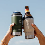 Two hands holding StubCup Green Stubby Cooler Coffee Cups by Get Rugd with cans and bottles in the sky background