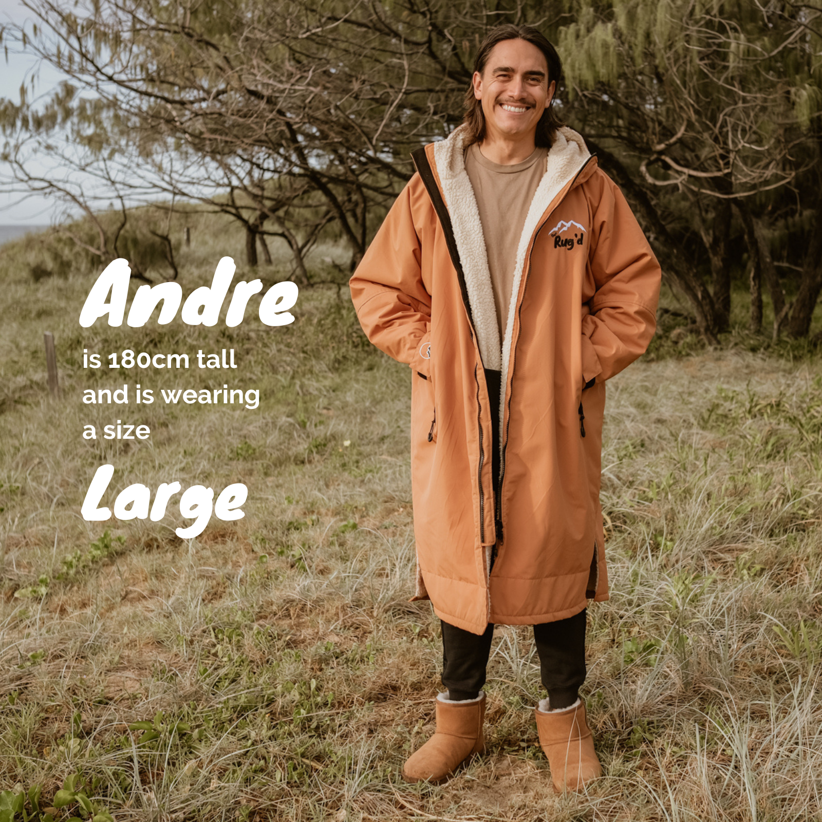 Get Rug'd Hydrocloak Waterproof Cream Robe in orange worn by a model outdoors with a cozy design