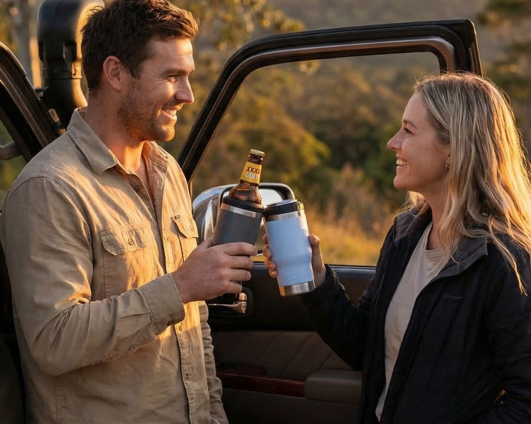 Couple enjoying cold drinks outdoors with the RUGD StubCup insulated stubby cooler and coffee cup on a Australian road trip