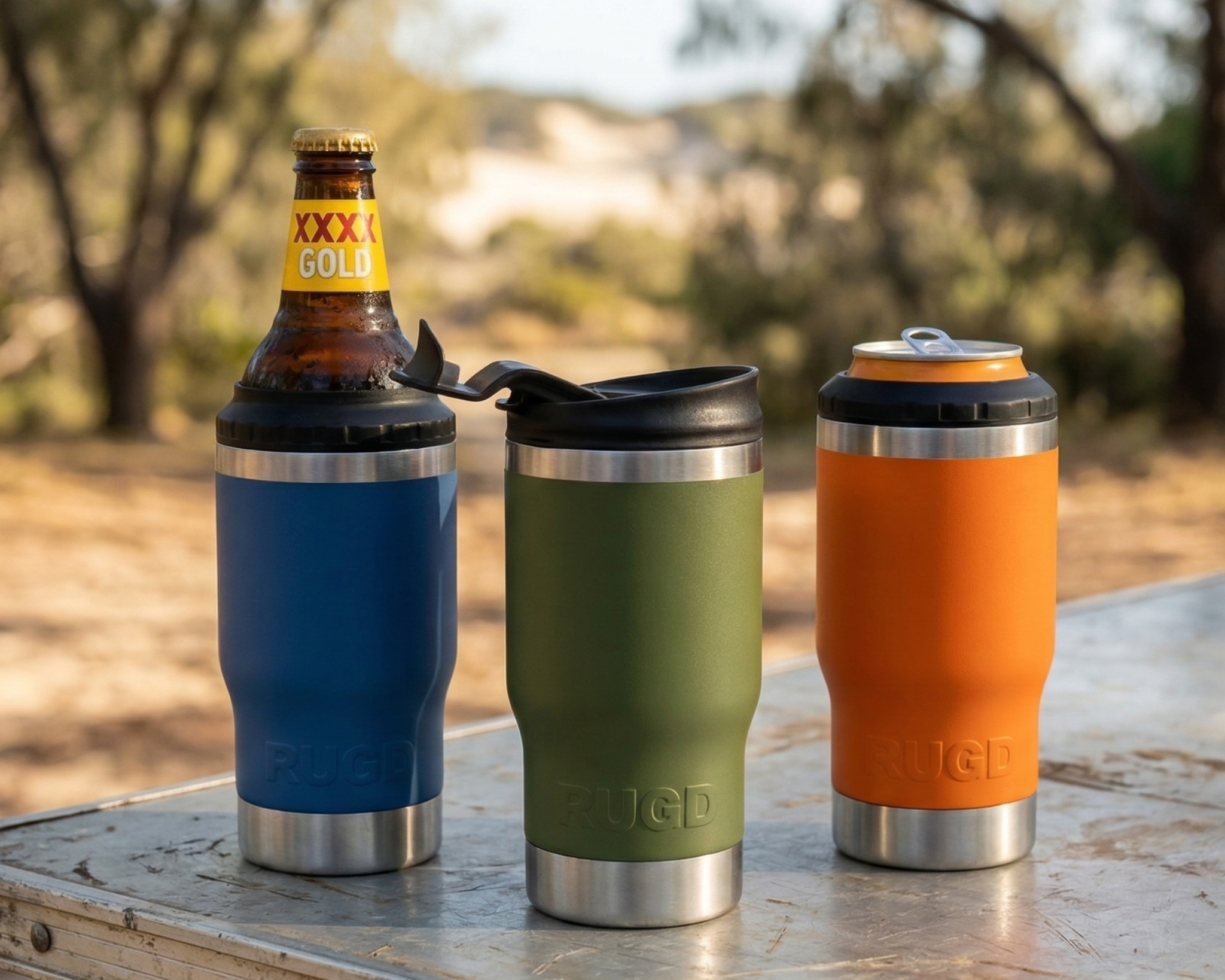 Three StubCups on a table with beer bottle, can and coffee lid