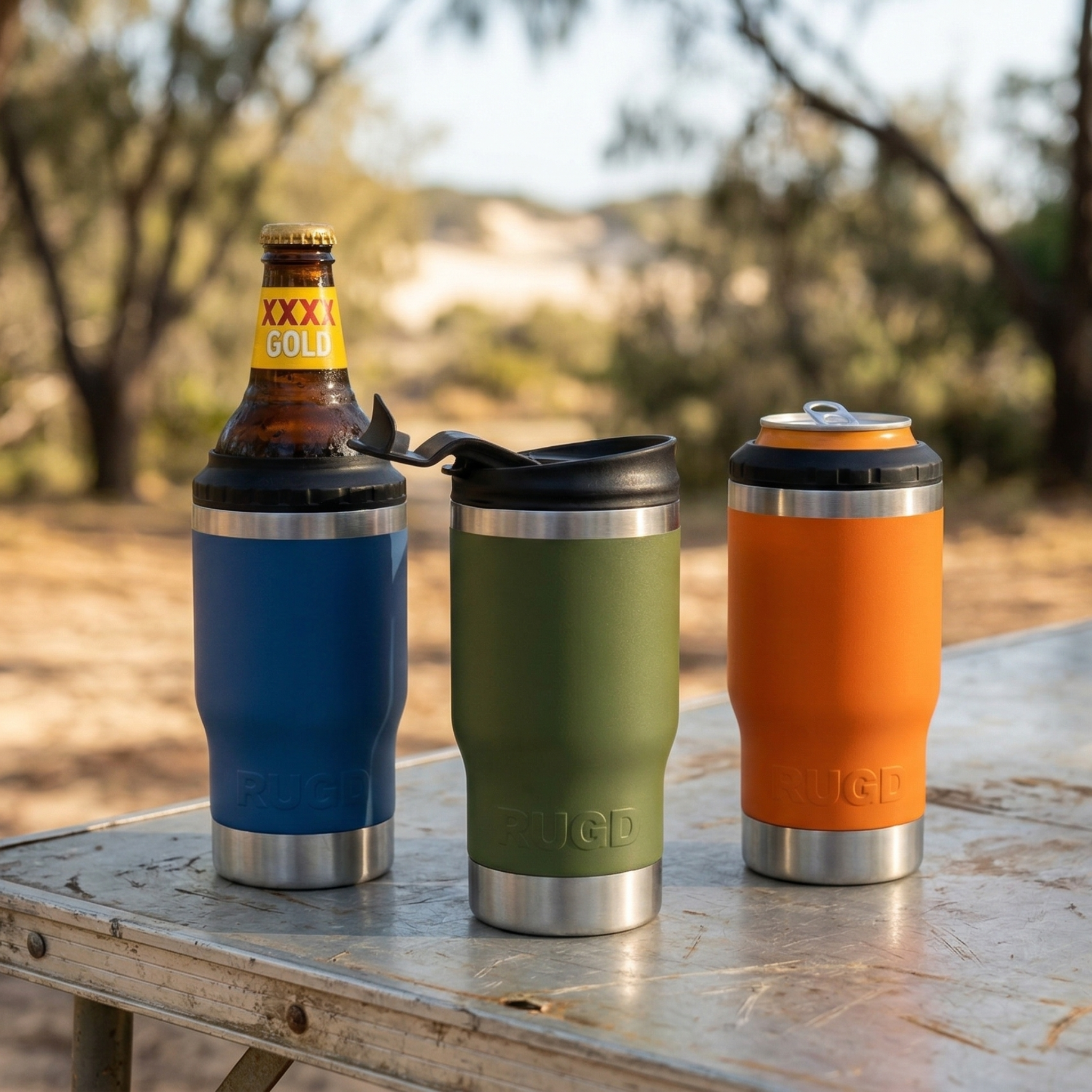 Three StubCups on a table with beer bottle, can and coffee lid