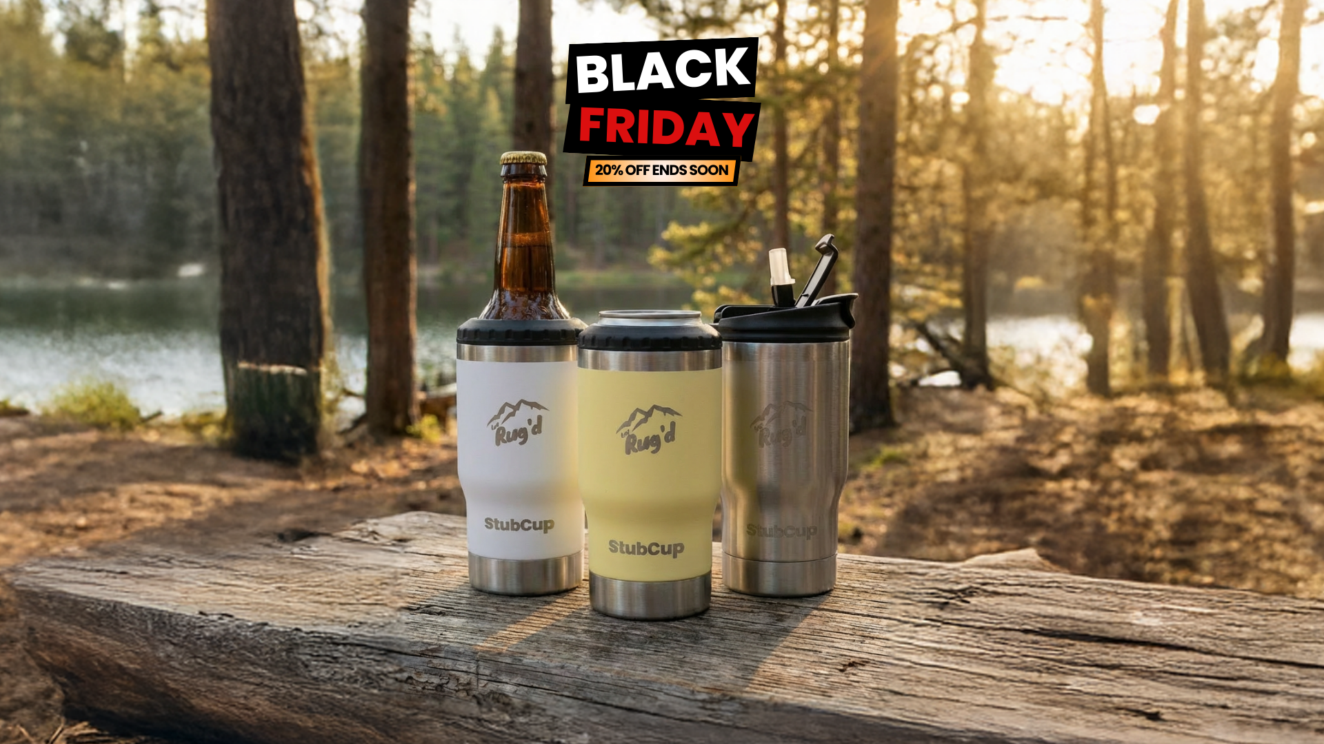 Three insulated cups on a wooden surface with a Black Friday banner in the background.