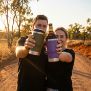 StubCup Purple tumbler purple beer drinking cup held by two people outdoors at sunset