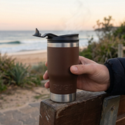 RUGD Stubby Cooler Holder Coffee Cup Mug 5in1 Stubcup in hand by the beach at sunrise