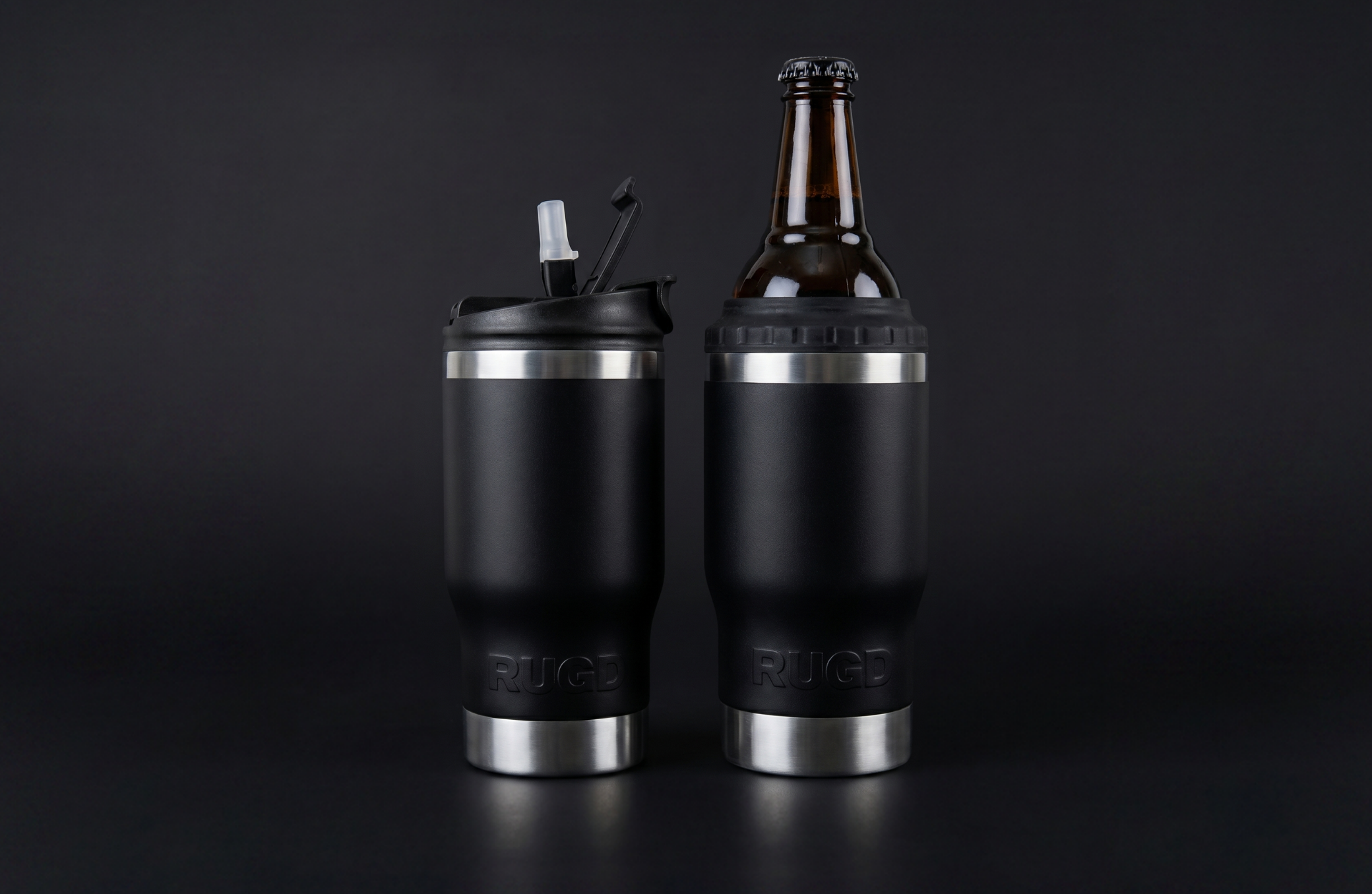 Two black insulated stubcups 5 in 1 stubby coolers and coffee cup on a black background