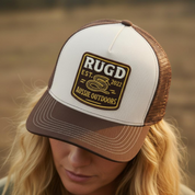 Get Rug'd Australian outdoor trucker cap featuring a vintage-style logo for outdoor enthusiasts