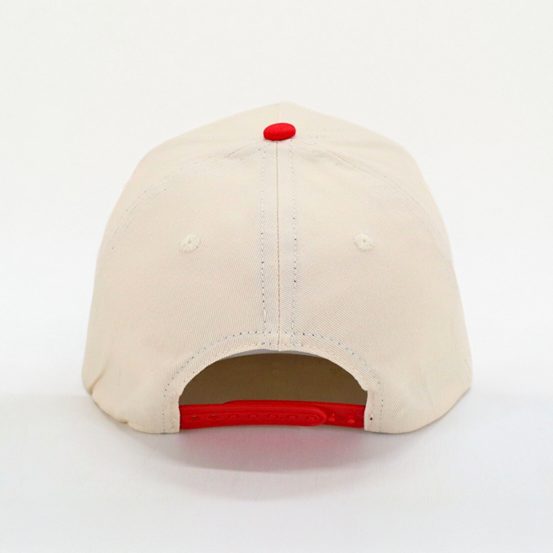 Back view of Get Rug'd cap featuring a beige color and red snapback closure