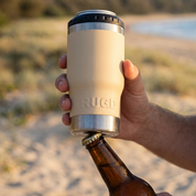 RUGD StubCup Beige stubby holder and coffee cup in hand by the beach for versatile beverage enjoyment