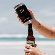 Get Rug'd StubCup stubby cooler coffee cup drinking beer being used to open a beer bottle on the beach