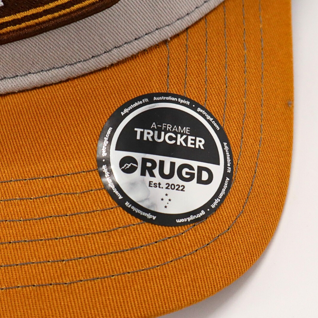 Get Rug'd A-Frame Trucker Cap in Brown and Yellow with Stylish Logo Patch