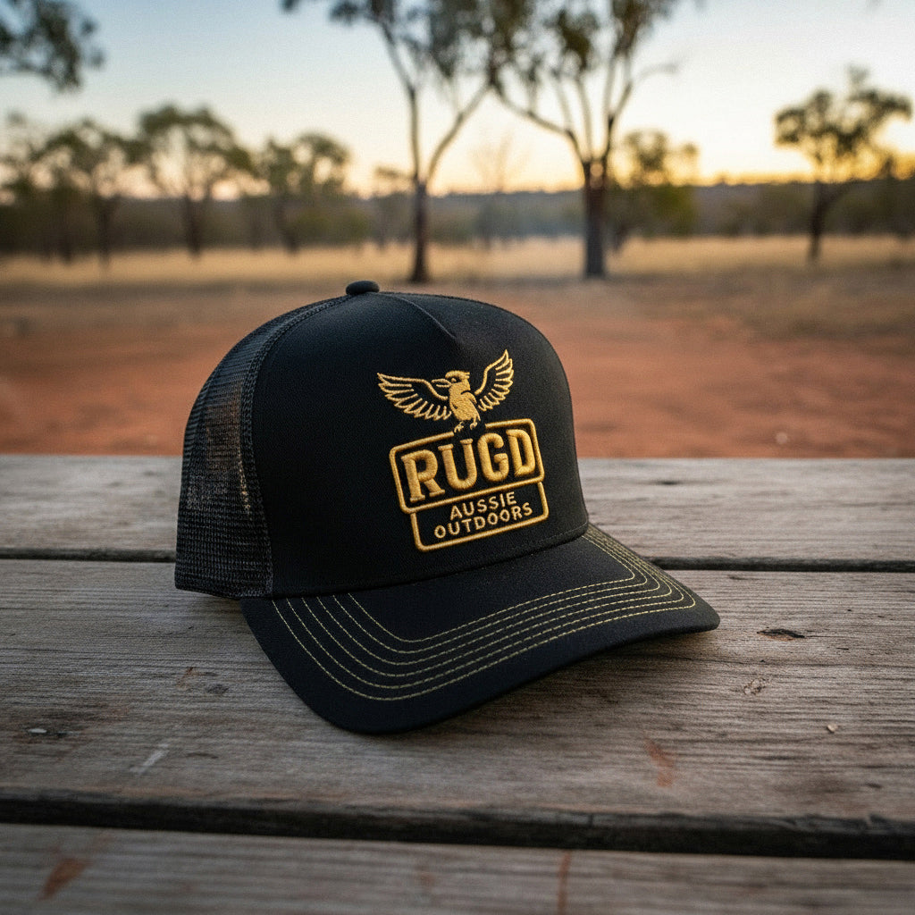 Get Rug'd Black Cap with Yellow Kookaburra logo and Mesh Back for Outdoors Enthusiasts