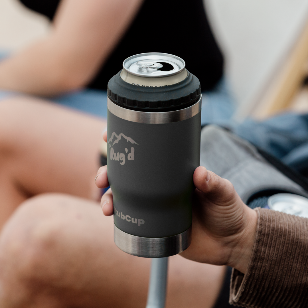 Get Rug'd StubCup Grey outdoor tumbler drinking cup held by a person with a can inside