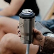 Get Rug'd StubCup stainless steel stubby cooler coffee cup held in a hand outdoors