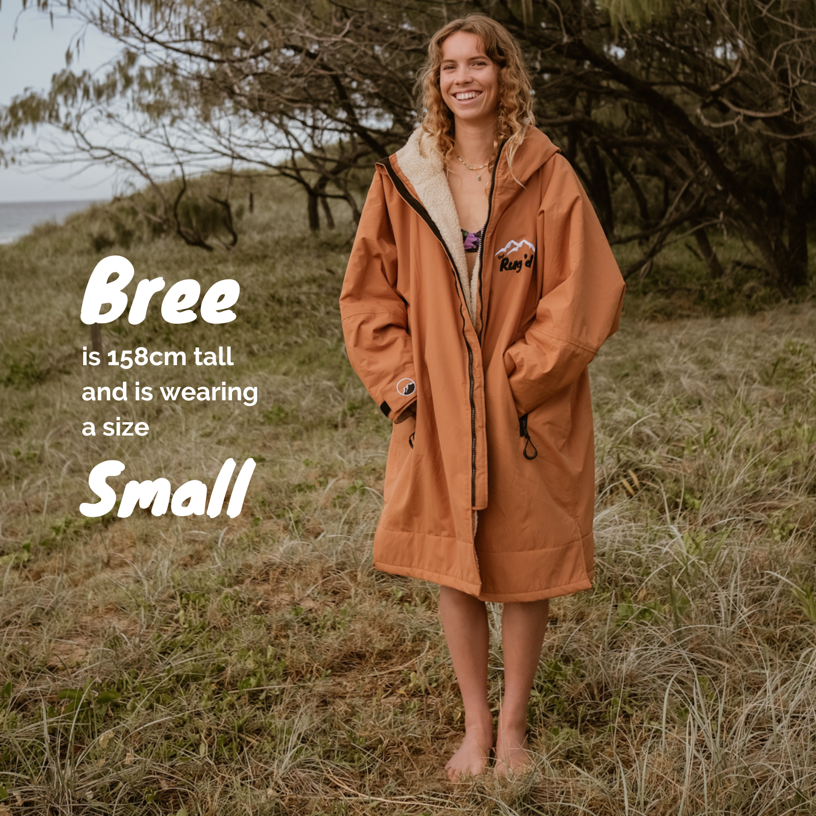 Get Rug'd Hydrocloak waterproof cream robe in orange with a cozy design and fur-lined hood